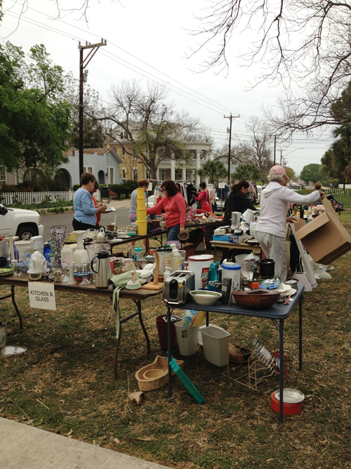 Shoppers comb through the thousands of items for sale at the Clutter for Cannoli Yard Sale 2013